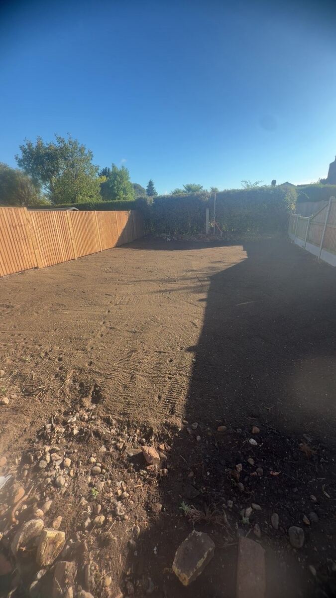 Same garden before turfing: bare, prepared soil